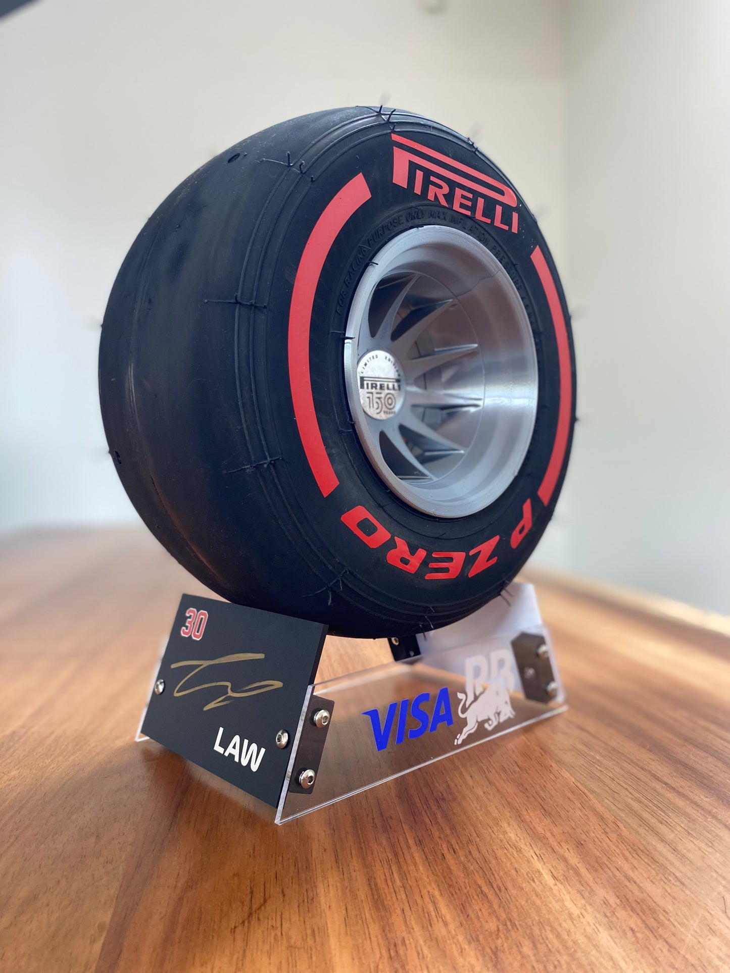 Liam Lawson SIGNED (RB) - F1 Tyre with Stand